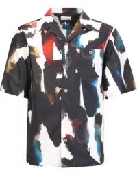 Alexander McQueen continues to explore graffiti prints for SS23, as is evidenced by this short-sleeved shirt